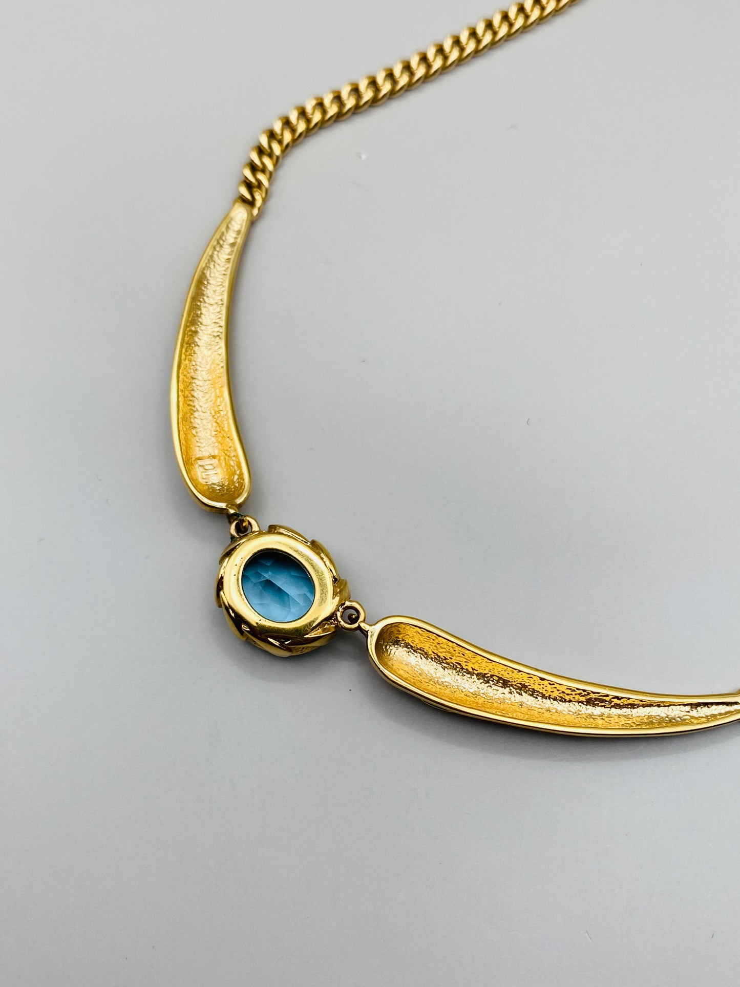 Collier Pierre Lang vintage – doré à pierre bleue centrale