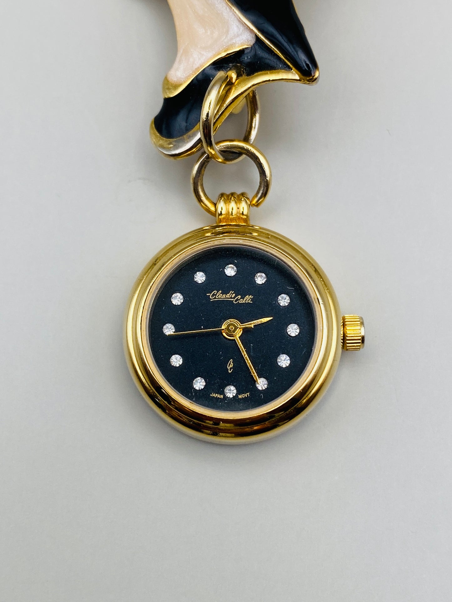 Broche-montre Vintage Claudio Calli – Émail noir et dorure