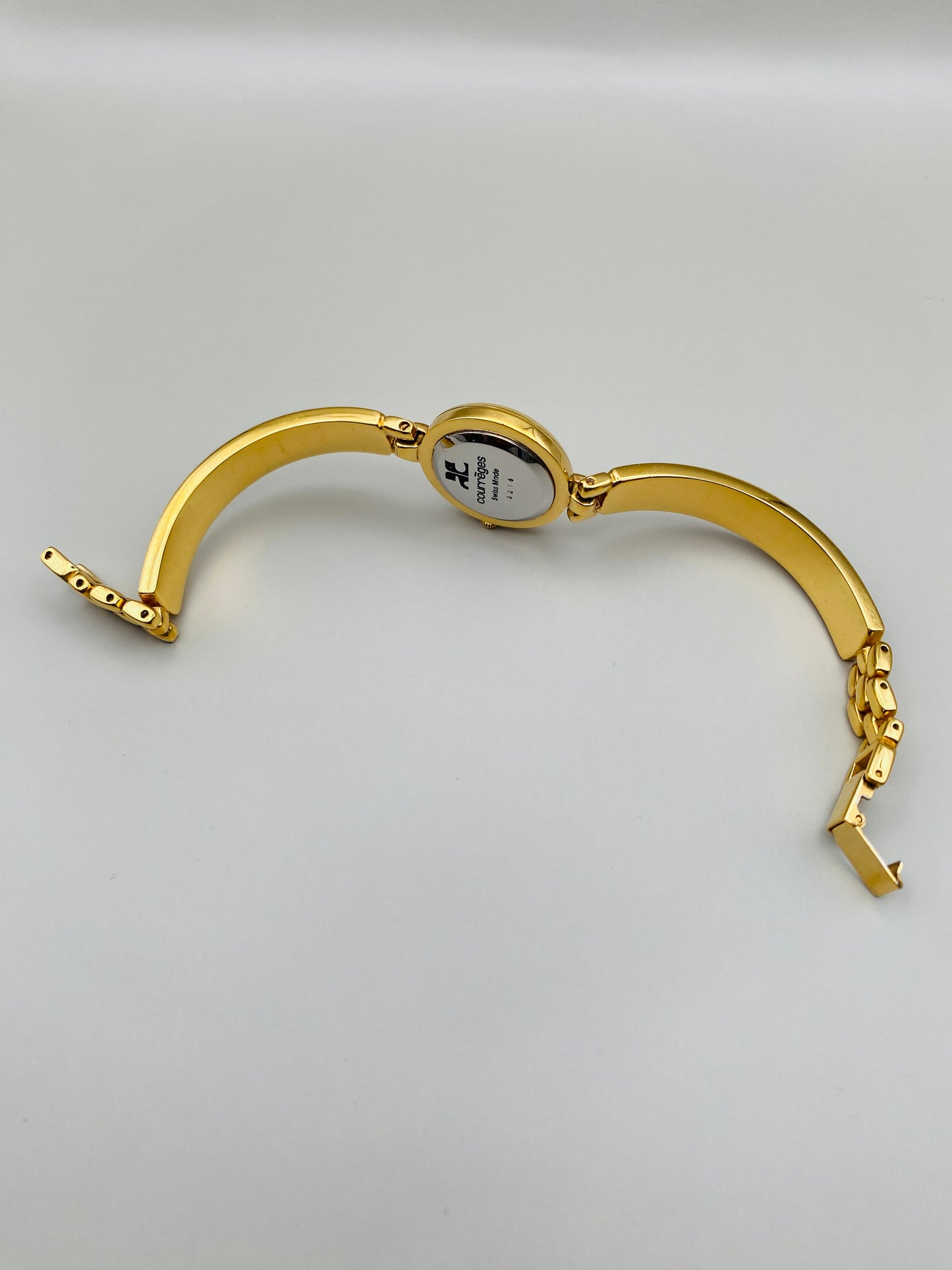 Montre Vintage Courrèges Paris – Swiss Made, dorée et cuir noir