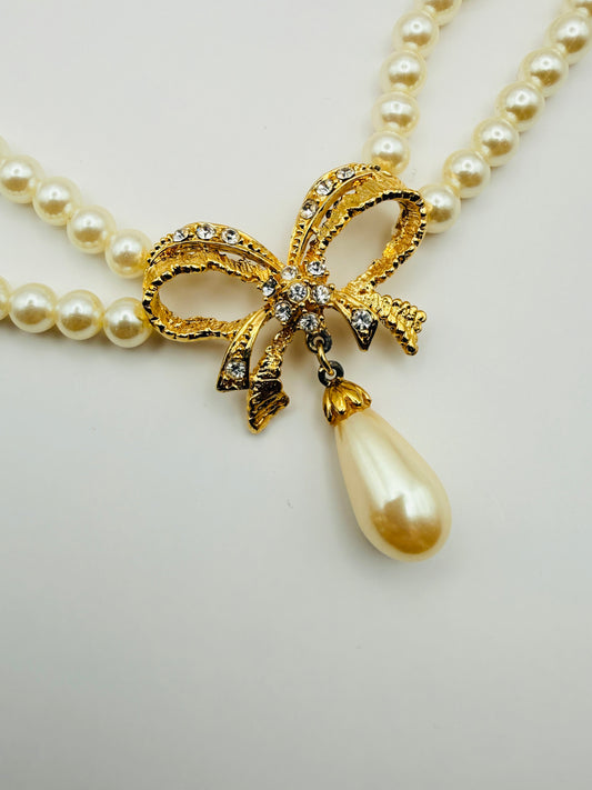 Collier vintage double rang de perles nacrées et nœud strassé