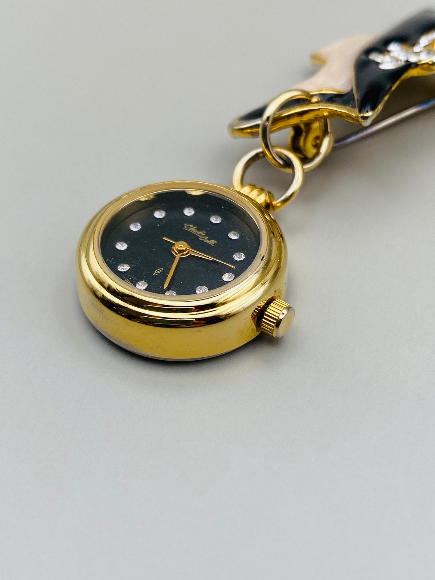 Broche-montre Vintage Claudio Calli – Émail noir et dorure