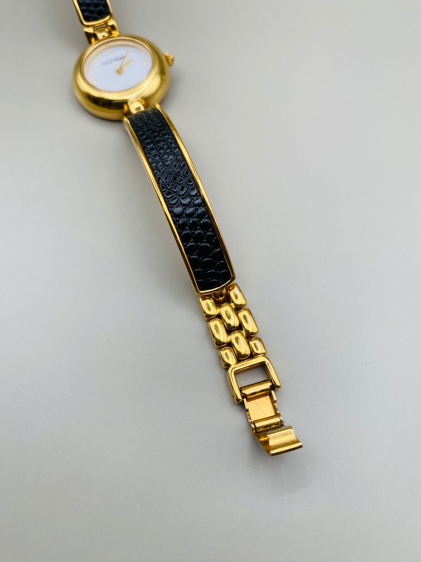 Montre Vintage Courrèges Paris – Swiss Made, dorée et cuir noir