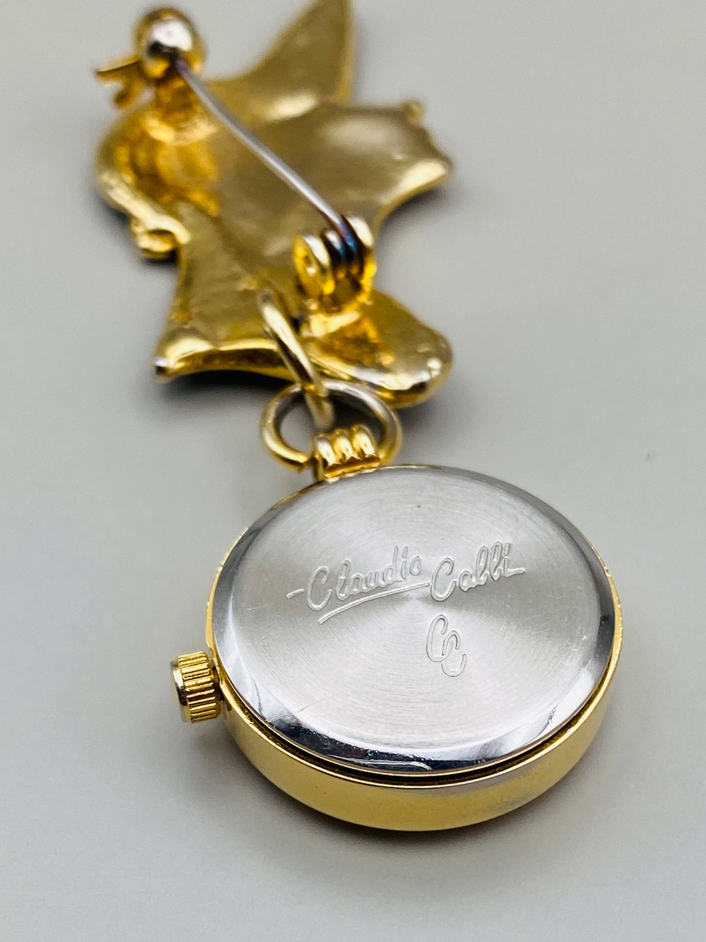 Broche-montre Vintage Claudio Calli – Émail noir et dorure