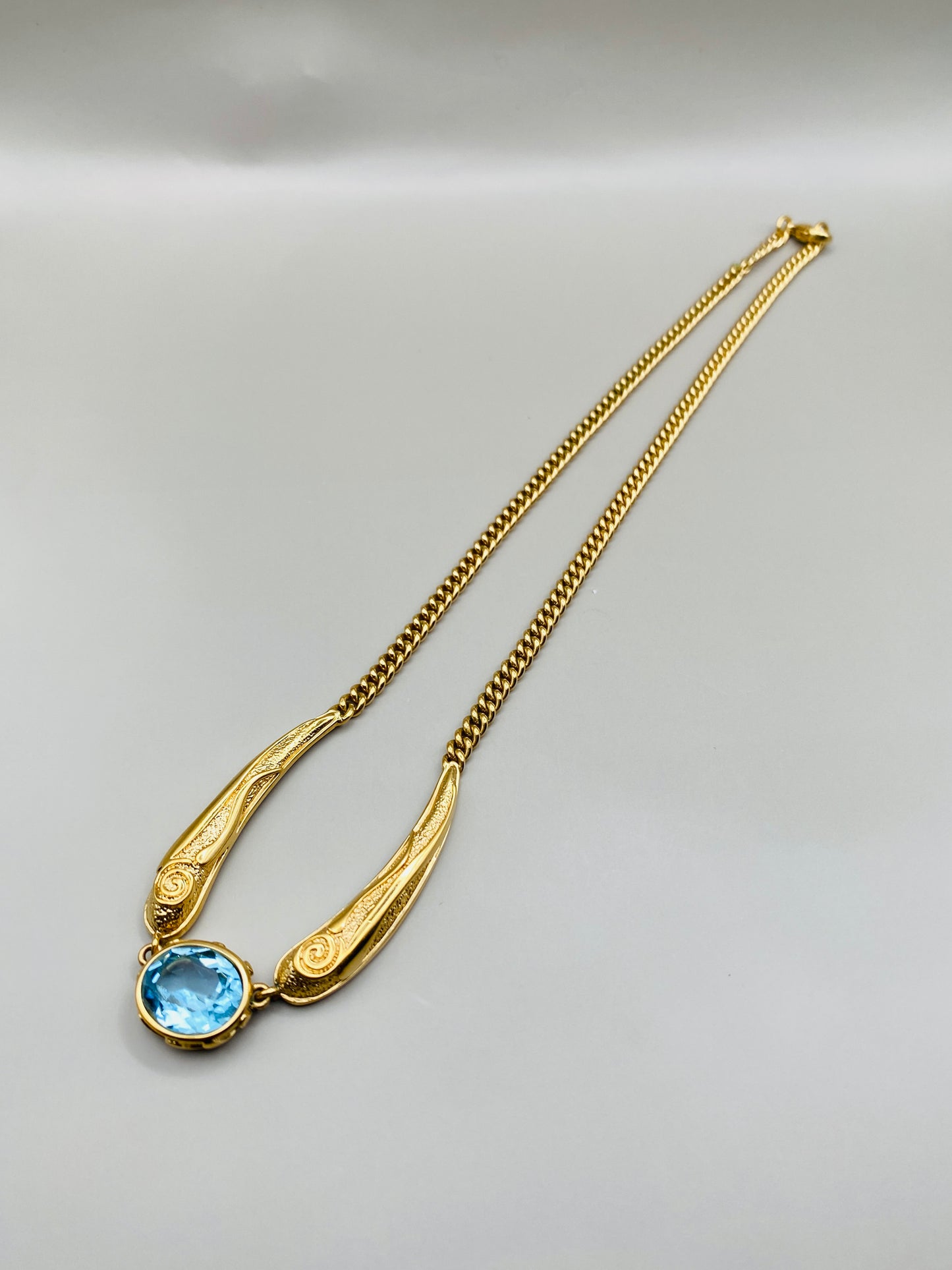 Collier Pierre Lang vintage – doré à pierre bleue centrale