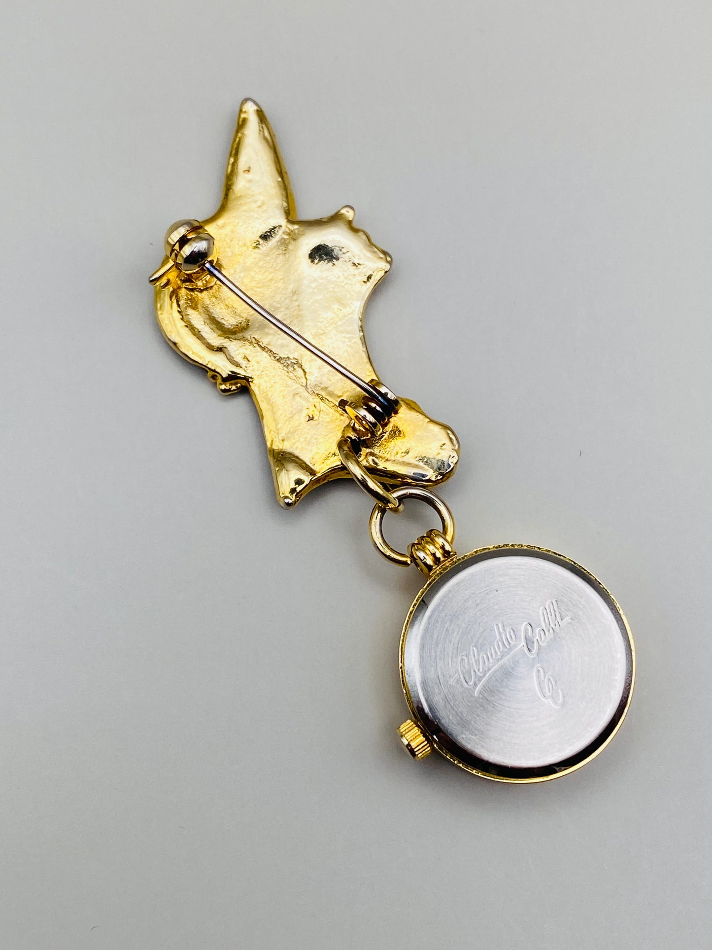 Broche-montre Vintage Claudio Calli – Émail noir et dorure